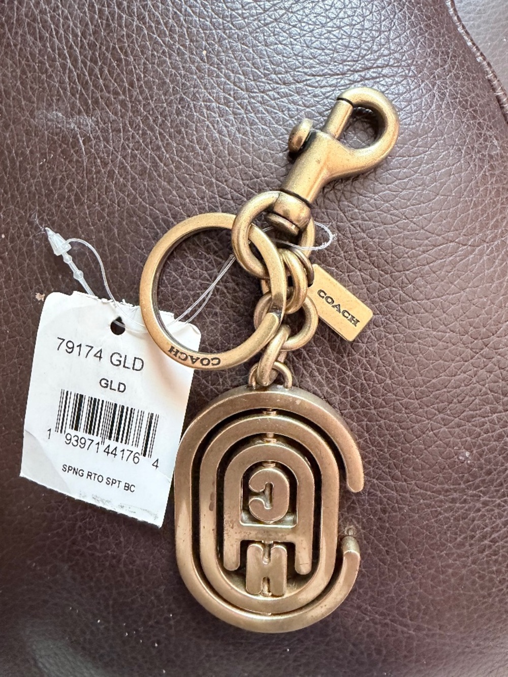 NEW RARE COACH SPINNING RETRO GRAPHIC GOLD BRASS FOB BAG CHARM KEYCHAIN 79174
